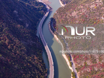 Vehicles drive on the Guzhao water highway in Xingshan County, Yichang City, Central China's Hubei Province, on December 18, 2024. (