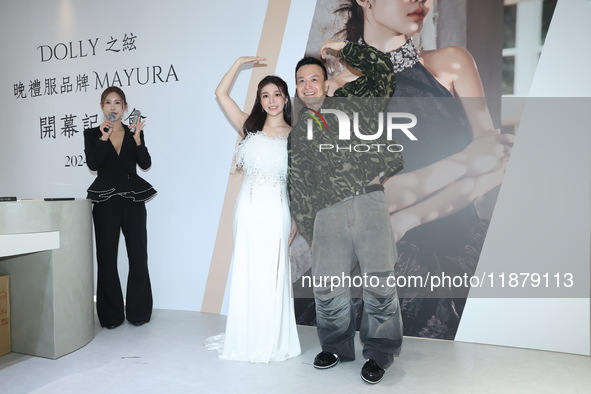 Dolly, a member of the girl group G.O.F., and Taiwanese singer Jason attend the opening ceremony of the dress brand in Taipei, Taiwan, on De...