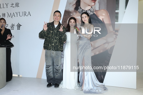 Dolly, a member of the girl group G.O.F., Taiwanese singer Jason, and actress Nikita attend the opening ceremony of the dress brand in Taipe...