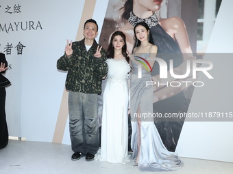 Dolly, a member of the girl group G.O.F., Taiwanese singer Jason, and actress Nikita attend the opening ceremony of the dress brand in Taipe...