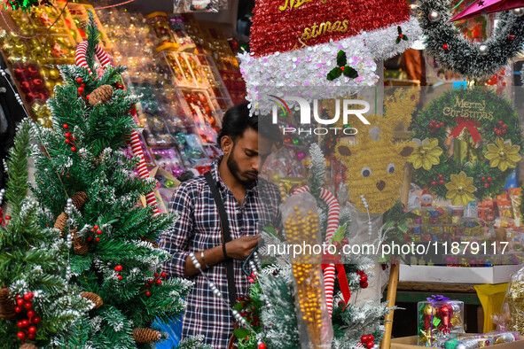 A shop sells decoration items for Christmas at a market ahead of Christmas in Kolkata, India, on December 18, 2024. 