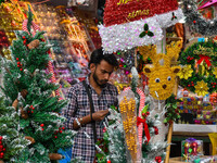 A shop sells decoration items for Christmas at a market ahead of Christmas in Kolkata, India, on December 18, 2024. (