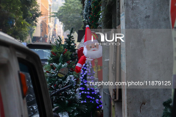 A shop sells decoration items for Christmas at a market ahead of Christmas in Kolkata, India, on December 18, 2024. 