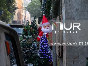 A shop sells decoration items for Christmas at a market ahead of Christmas in Kolkata, India, on December 18, 2024. (