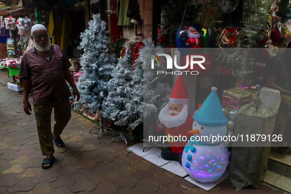 A shop sells decoration items for Christmas at a market ahead of Christmas in Kolkata, India, on December 18, 2024. 