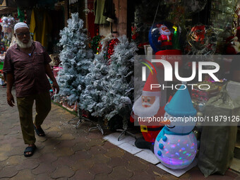 A shop sells decoration items for Christmas at a market ahead of Christmas in Kolkata, India, on December 18, 2024. (