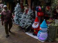 A shop sells decoration items for Christmas at a market ahead of Christmas in Kolkata, India, on December 18, 2024. (