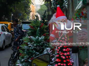 A shop sells decoration items for Christmas at a market ahead of Christmas in Kolkata, India, on December 18, 2024. (