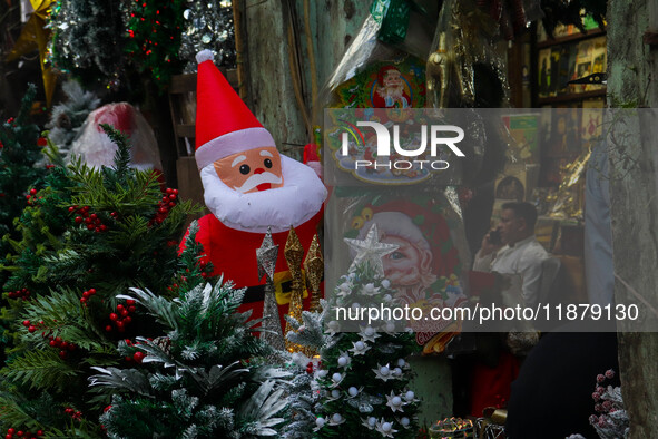 A shop sells decoration items for Christmas at a market ahead of Christmas in Kolkata, India, on December 18, 2024. 