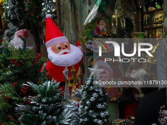 A shop sells decoration items for Christmas at a market ahead of Christmas in Kolkata, India, on December 18, 2024. (