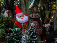 A shop sells decoration items for Christmas at a market ahead of Christmas in Kolkata, India, on December 18, 2024. (