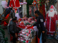 A shop sells decoration items for Christmas at a market ahead of Christmas in Kolkata, India, on December 18, 2024. (