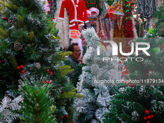 A shop sells decoration items for Christmas at a market ahead of Christmas in Kolkata, India, on December 18, 2024. (