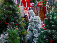 A shop sells decoration items for Christmas at a market ahead of Christmas in Kolkata, India, on December 18, 2024. (