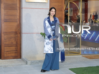 Taiwanese hostess Patty Lee Pei-yu attends the opening event of a department store in Taipei, China, on December 18, 2024. (