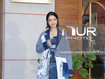 Taiwanese hostess Patty Lee Pei-yu attends the opening event of a department store in Taipei, China, on December 18, 2024. (