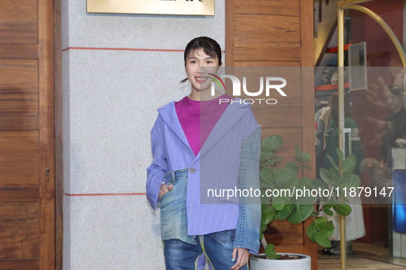 In Taipei, China, on December 18, 2024, Taipei boxer Huang Xiaowen attends the opening of the department store in Taipei, Taiwan province, C...