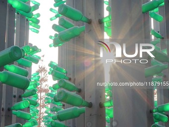 More than 30,000 green plastic beer bottles form a ''beer jungle'' by Tangdao Bay in the West Coast New District of Qingdao, Shandong provin...