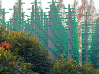 More than 30,000 green plastic beer bottles form a ''beer jungle'' by Tangdao Bay in the West Coast New District of Qingdao, Shandong provin...