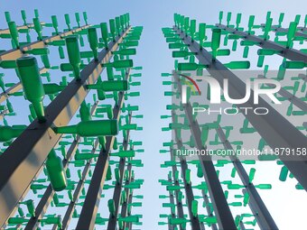 More than 30,000 green plastic beer bottles form a ''beer jungle'' by Tangdao Bay in the West Coast New District of Qingdao, Shandong provin...