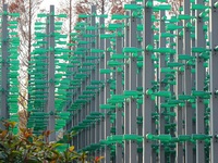 More than 30,000 green plastic beer bottles form a ''beer jungle'' by Tangdao Bay in the West Coast New District of Qingdao, Shandong provin...