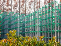 More than 30,000 green plastic beer bottles form a ''beer jungle'' by Tangdao Bay in the West Coast New District of Qingdao, Shandong provin...