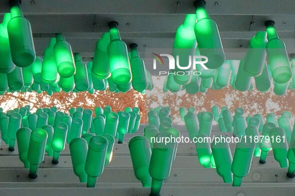 More than 30,000 green plastic beer bottles form a ''beer jungle'' by Tangdao Bay in the West Coast New District of Qingdao, Shandong provin...