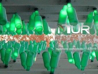 More than 30,000 green plastic beer bottles form a ''beer jungle'' by Tangdao Bay in the West Coast New District of Qingdao, Shandong provin...