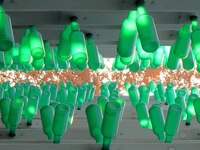 More than 30,000 green plastic beer bottles form a ''beer jungle'' by Tangdao Bay in the West Coast New District of Qingdao, Shandong provin...