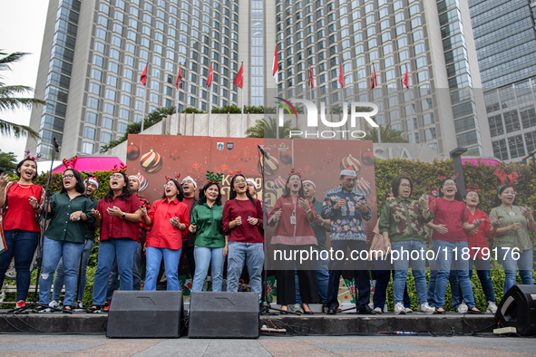 The choir group of the DKI Jakarta Provincial Government performs during the Christmas Carol to celebrate the upcoming Christmas in Jakarta,...