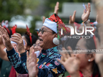 The choir group of the DKI Jakarta Provincial Government performs during the Christmas Carol to celebrate the upcoming Christmas in Jakarta,...