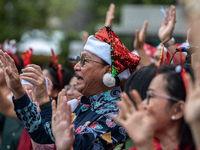 The choir group of the DKI Jakarta Provincial Government performs during the Christmas Carol to celebrate the upcoming Christmas in Jakarta,...