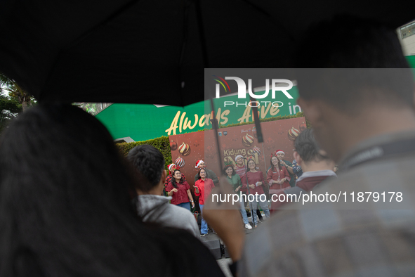 The choir group of the DKI Jakarta Provincial Government performs during the Christmas Carol to celebrate the upcoming Christmas in Jakarta,...