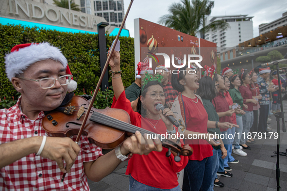 The choir group of the DKI Jakarta Provincial Government performs during the Christmas Carol to celebrate the upcoming Christmas in Jakarta,...