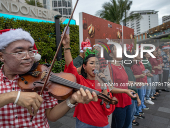 The choir group of the DKI Jakarta Provincial Government performs during the Christmas Carol to celebrate the upcoming Christmas in Jakarta,...