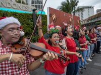 The choir group of the DKI Jakarta Provincial Government performs during the Christmas Carol to celebrate the upcoming Christmas in Jakarta,...