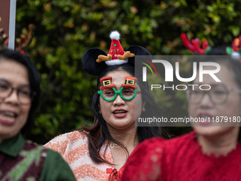 The choir group of the DKI Jakarta Provincial Government performs during the Christmas Carol to celebrate the upcoming Christmas in Jakarta,...