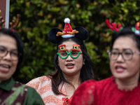 The choir group of the DKI Jakarta Provincial Government performs during the Christmas Carol to celebrate the upcoming Christmas in Jakarta,...