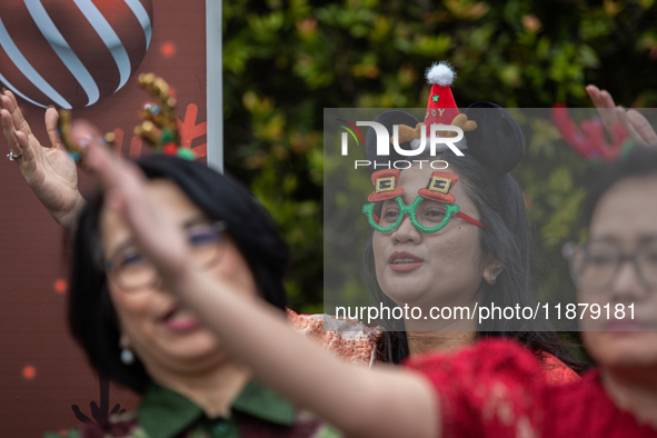 The choir group of the DKI Jakarta Provincial Government performs during the Christmas Carol to celebrate the upcoming Christmas in Jakarta,...