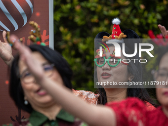 The choir group of the DKI Jakarta Provincial Government performs during the Christmas Carol to celebrate the upcoming Christmas in Jakarta,...