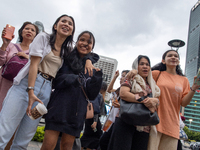 People sing together during the Christmas Carol to celebrate the upcoming Christmas in Jakarta, Indonesia, on December 18, 2024. This countr...