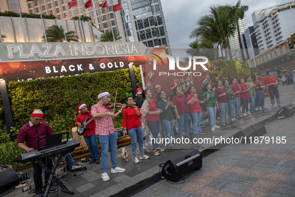 The choir group of the DKI Jakarta Provincial Government performs during the Christmas Carol to celebrate the upcoming Christmas in Jakarta,...