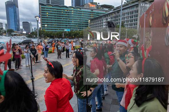 The choir group of the DKI Jakarta Provincial Government performs during the Christmas Carol to celebrate the upcoming Christmas in Jakarta,...