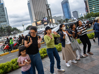 People dance during the Christmas Carol to celebrate the upcoming Christmas in Jakarta, Indonesia, on December 18, 2024. This world's larges...