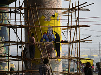 An artist creates a mural painting of the Hindu God Shri Ram on a pillar of the Shastri bridge over the river Ganges as part of the ongoing...