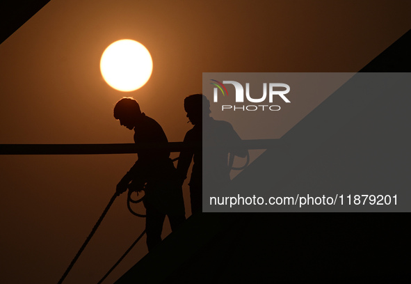 Labourers prepare a religious pandal or tent ahead of the upcoming Maha Kumbh Mela festival 2025 in Prayagraj, India, on December 18, 2024. 