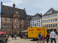 DHL delivers a parcel in Marburg, Germany, on August 14, 2023. (