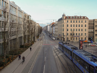 A tram travels along Bayerstrasse in Munich, Bavaria, Germany, on December 17, 2024. Pedestrians, cyclists, and vehicles share the busy urba...