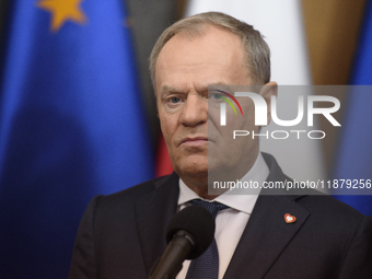 Polish Prime Minister Donald Tusk holds a press conference before his departure to Brussels in Warsaw, Poland, on December 18, 2024. (