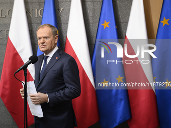 Polish Prime Minister Donald Tusk holds a press conference before his departure to Brussels in Warsaw, Poland, on December 18, 2024. (